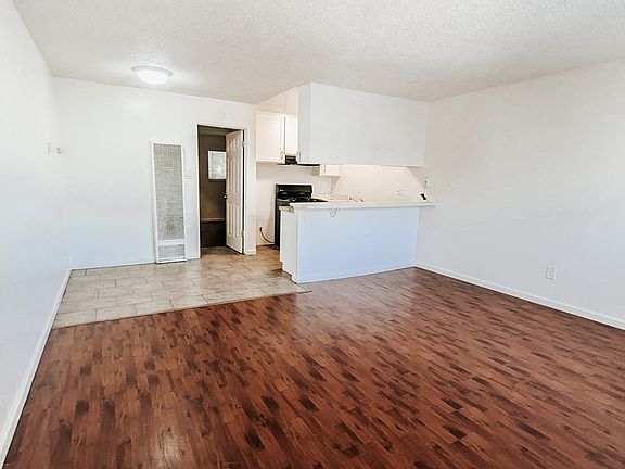 NEW LVP FLOORING BEING INSTALLED - COLOR DARK TO MEDIUM WOOD