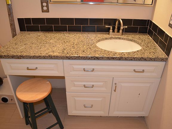 bathroom vanity, granite countertop with subway tile backspl