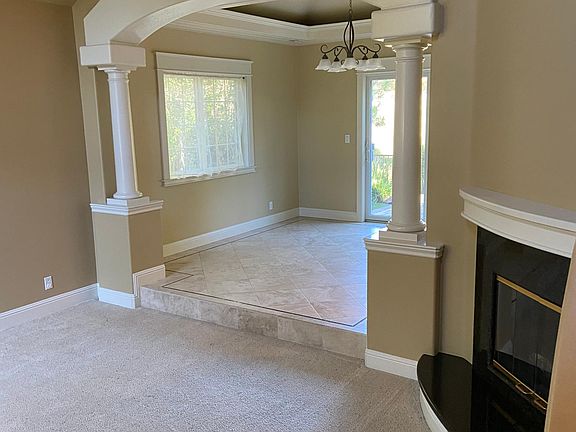 Living room, looking into dining room, gas fireplace at the flick of a switch.
Lots of natural light and open feeling.