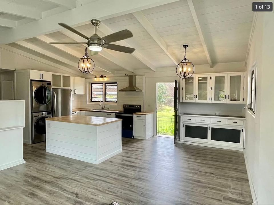 Open concept living room/kitchen with new appliances. Room for a large couch and TV. Coffee bar with plenty of storage!