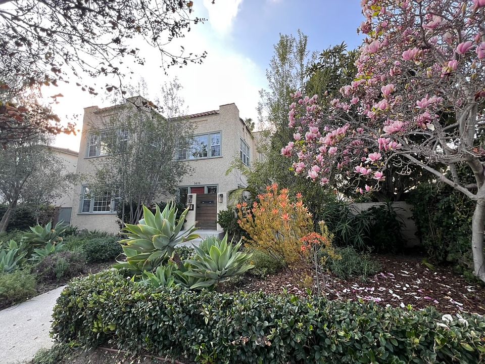 Front yard, colorful landscape and duplex