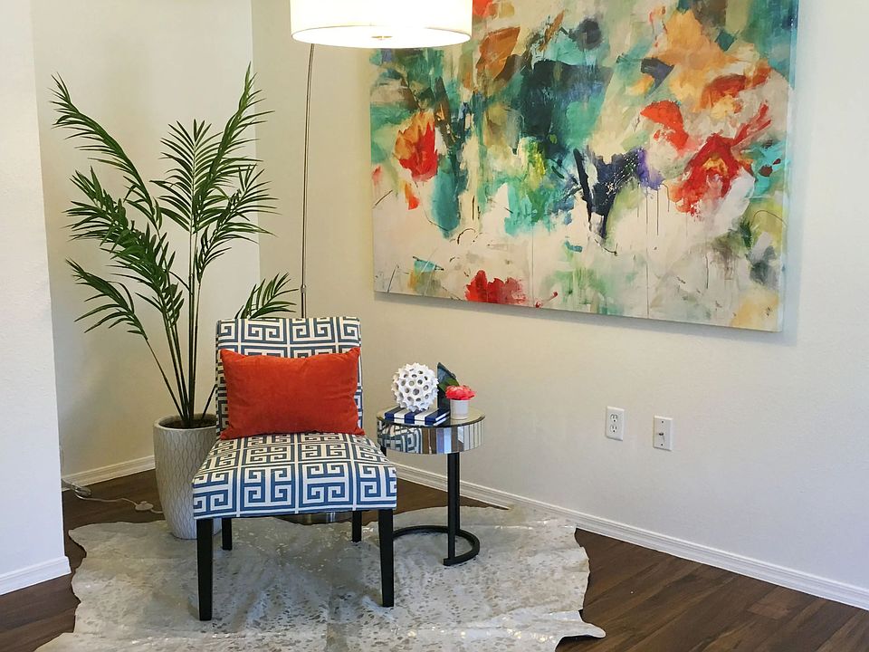 Relax in spacious living rooms with wood-style flooring, opening to your private patio.