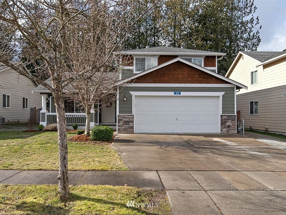 Your new home offers such beautiful curb appeal with the cedar shake, paint contrast, and the stone accents.