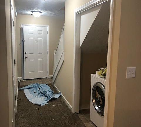 Hall, Laundry & Front Door - As viewed from the Kitchen
