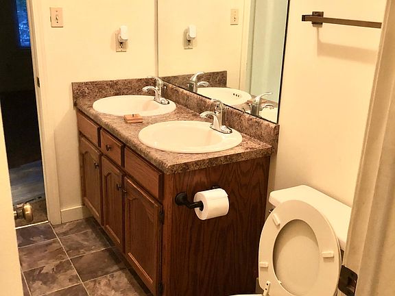 bathroom has separate sinks 