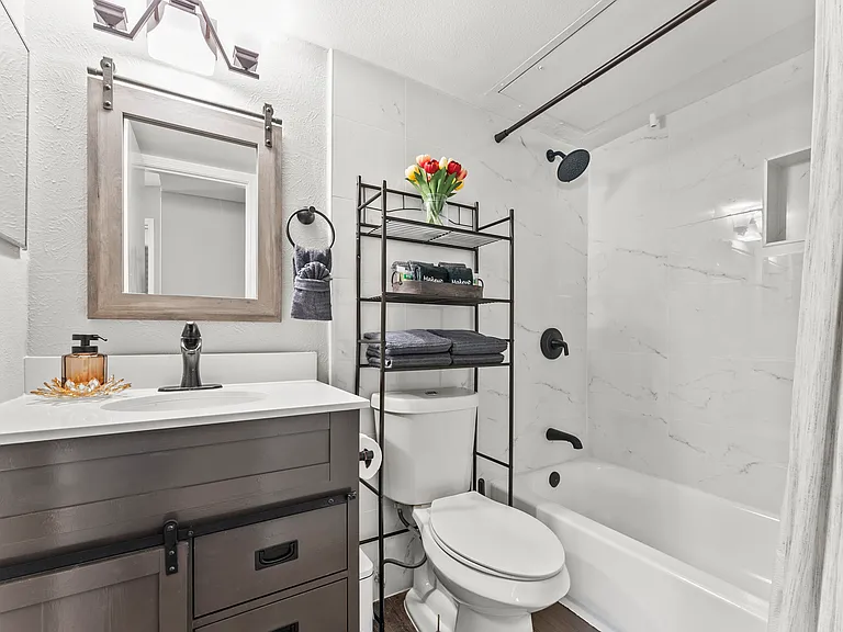 Fully remodeled bathroom, with a shower-tub combo