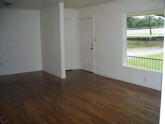 LIVING ROOM - FRONT DOOR AND WINDOW