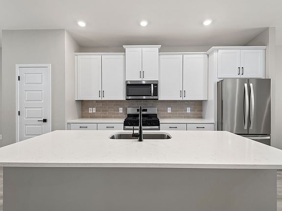 The kitchen of the Bisbee has all the counter space needed for cooking your favorite meals.
