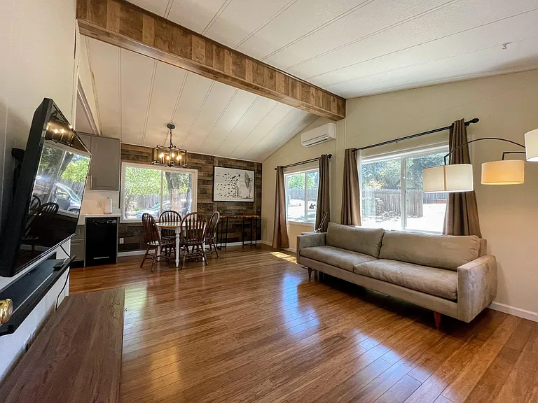 A high vaulted ceiling opens the space even more.