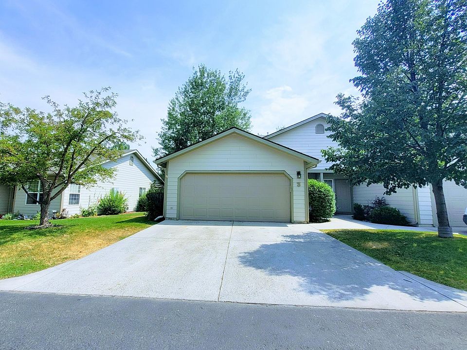 Two-car garage and driveway and sheltered entrance