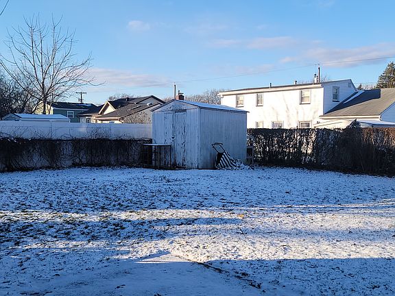Fully fenced in yard with patio