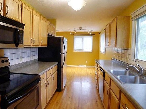 Spacious galley kitchen with large eat-in area