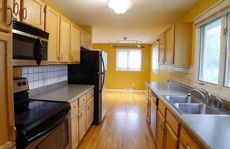 Spacious galley kitchen with large eat-in area
