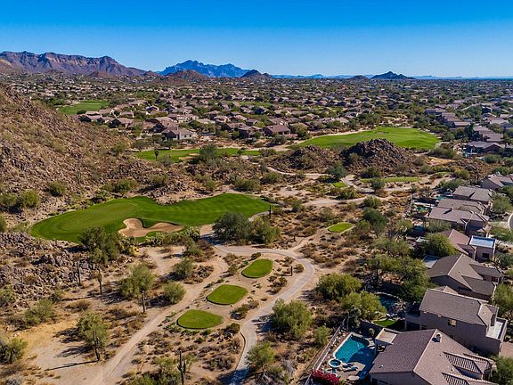 Residence backs up to Las Sendas Golf Course; professional 6th tee box at base of Spook Mountain