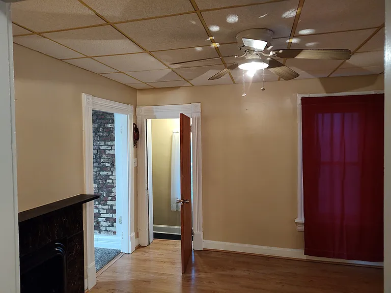middle room/dining room with marble fire place