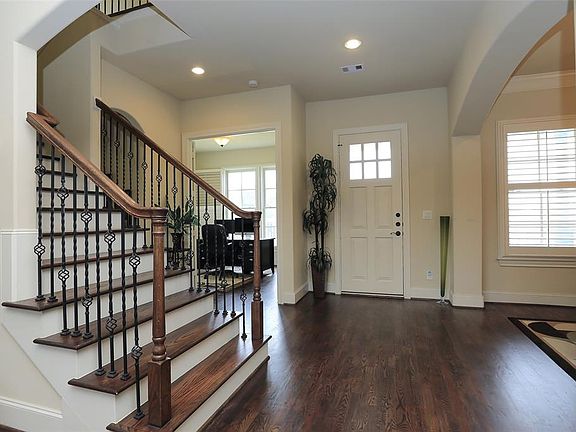 As you enter into the home you are greeted with beautiful archways and GORGEOUS hardwood floors which are throughout the entire first floor and up the stairs! Now let's take a look around this open-concept beauty.