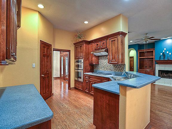 Kitchen is open to den