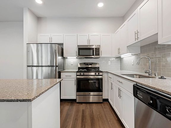 Modern kitchens with granite counter-tops and tile back-splash