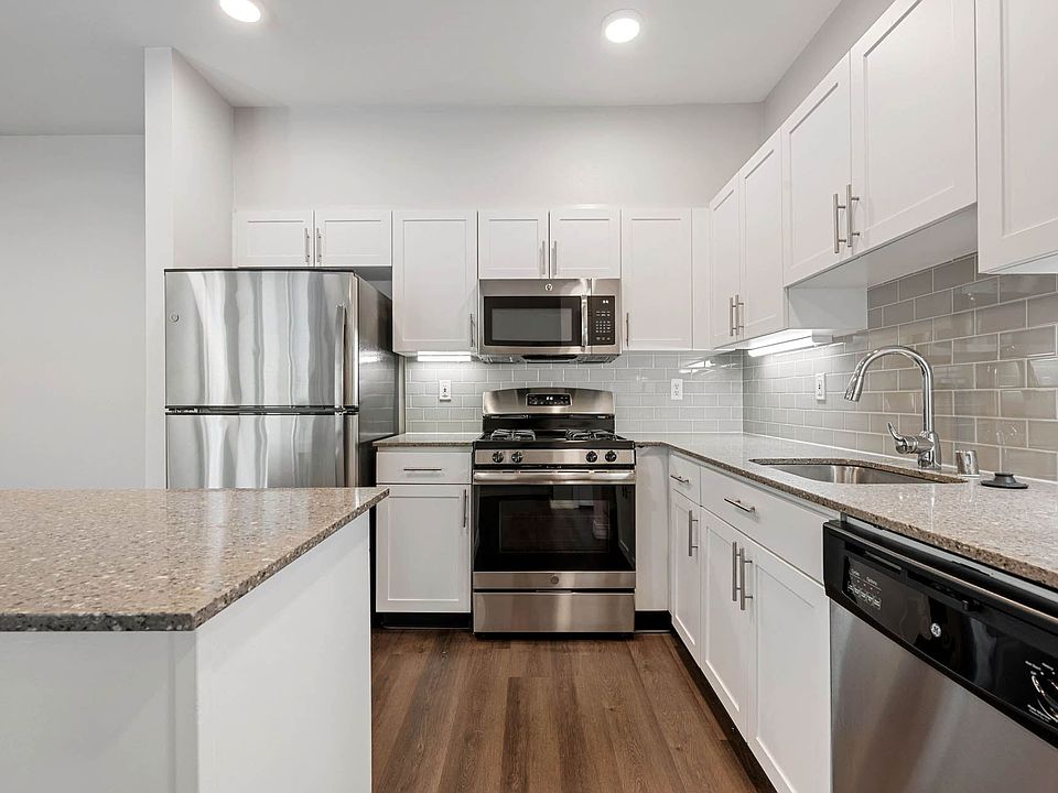 Modern kitchens with granite counter-tops and tile back-splash
