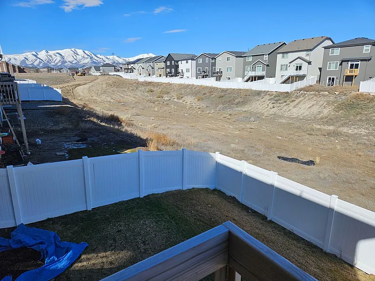 Open space is currently being finished by the city with a small park and walking paths. Fenced backyard has back gate for easy access onto the miles of trails of Eagle Mountain!