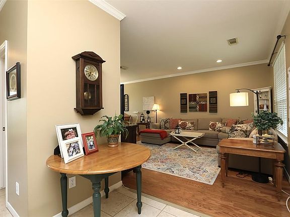WELCOME HOME: The spacious entry opens to the living room/dining room combination that runs from the front to the back of the house.