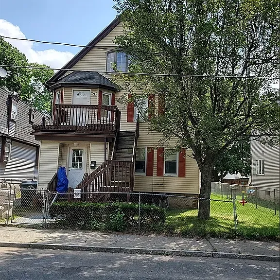 Front of property. Fully fenced. Stairs that go to second floor door actually leads up to 3rd floor (APT2).
