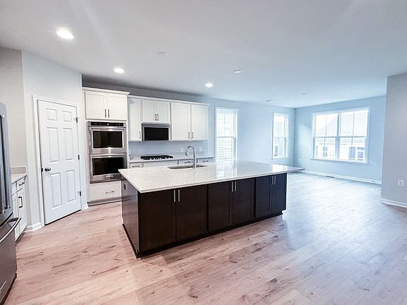 The kitchen in the Matisse on homesite 1019 at Hiatt Pointe at Snowden Bridge by Brookfield Resident