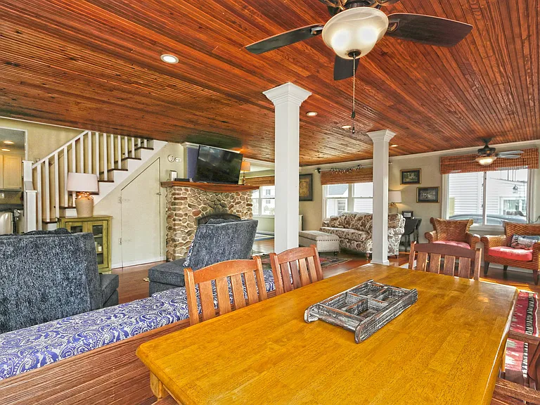 Dining table in living room with views of the water. Also functions as a work space.