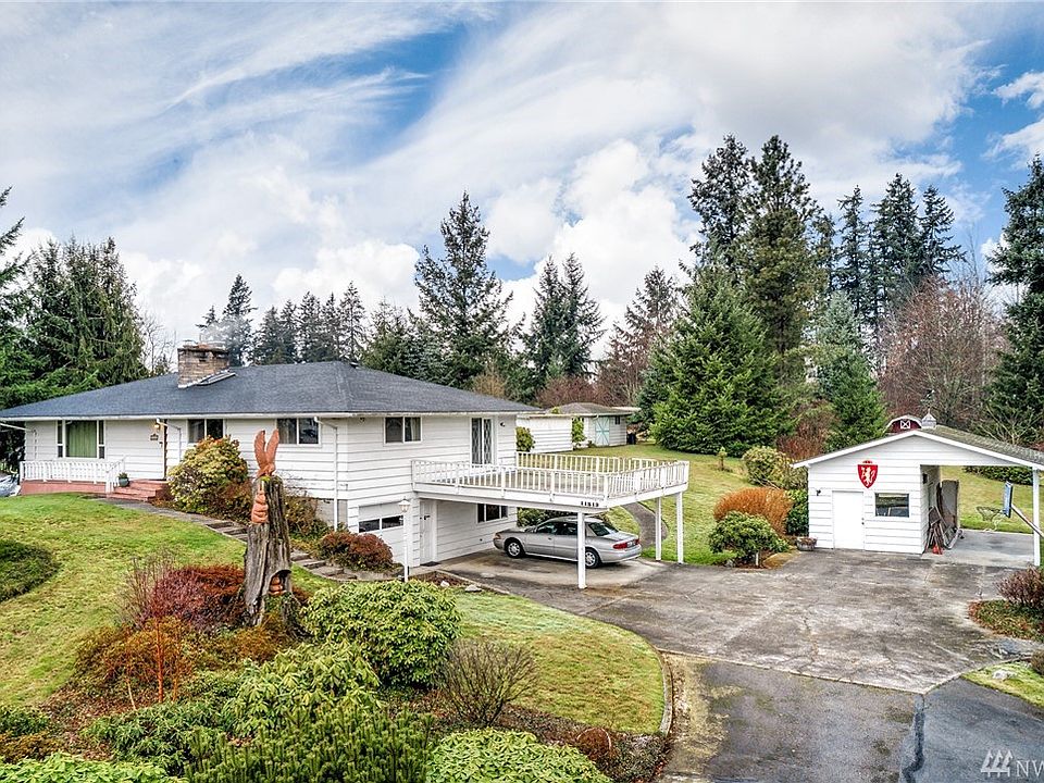 Mid-century home immersed on 2.64 Acres in the beautiful Edgewood countryside. 