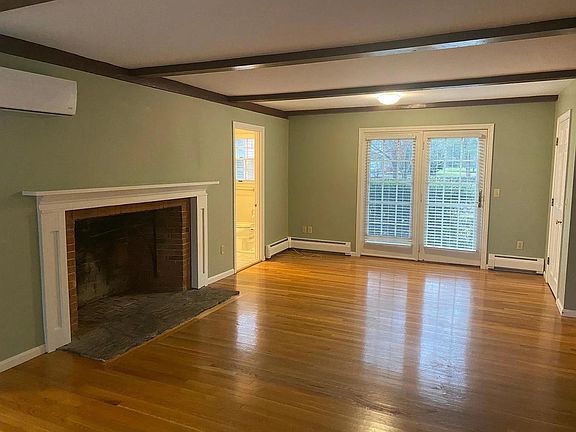 Living area - mini split produced heat and central air, double doors lead to private cement patio that is solely for this unit.