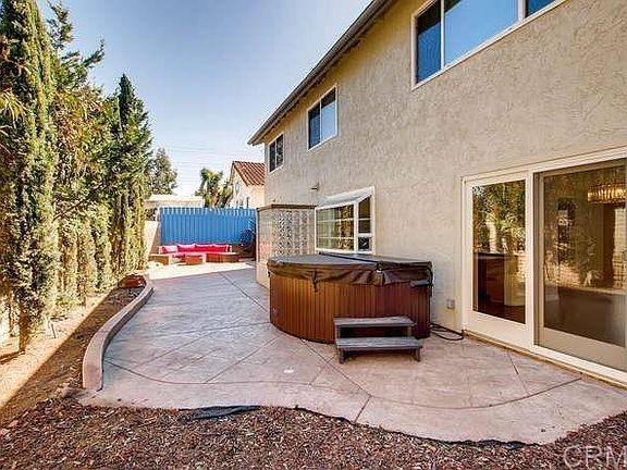 Backyard - all easy maintenance with a hot tub and outdoor shower included