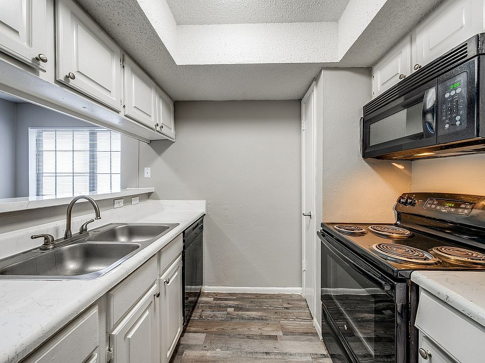 Encounter culinary delight in this sleek and modern kitchen.