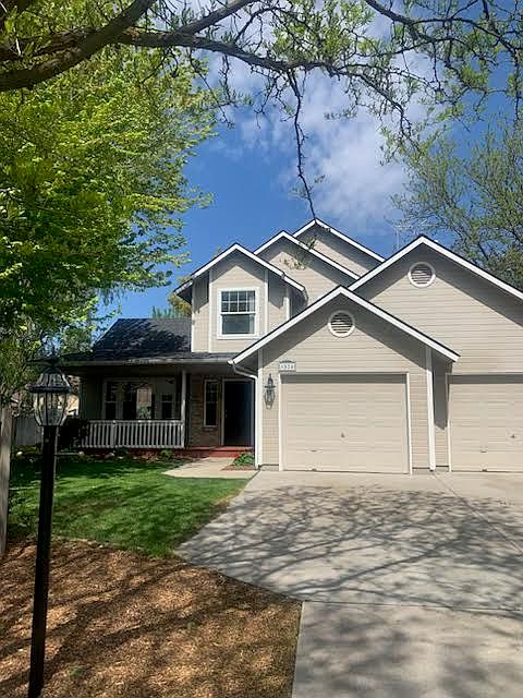 The house sits well back from the street down a 75 foot drive way, on a cul-de-sac. Both garage doors have remote devices and the main door has keyless entry.