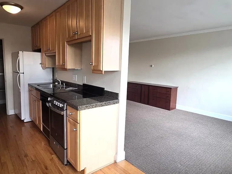 Large pantry and full kitchen separate from living space.