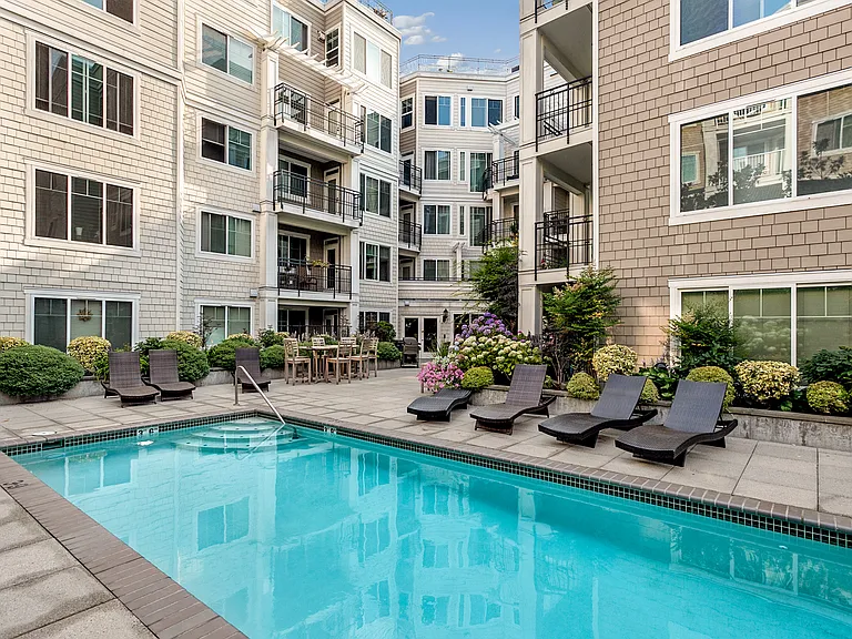 2nd floor pool terrace with grills, Ballard's only outdoor heated pool, and hot tub.