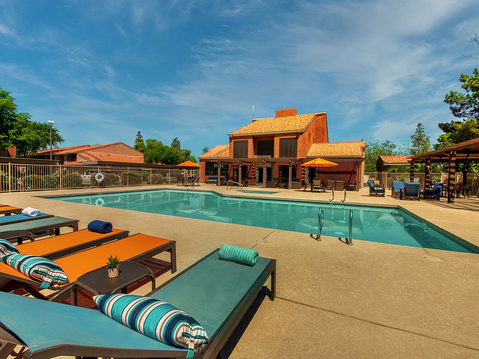 Two resort style swimming pools with cabanas and grills