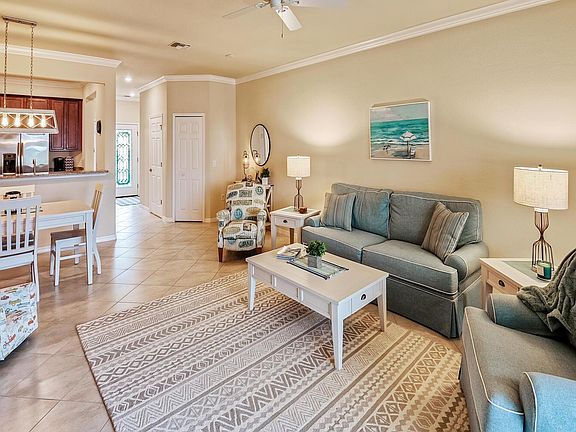 Luxurious, comfy, coastal furniture surrounds you in this open floor plan