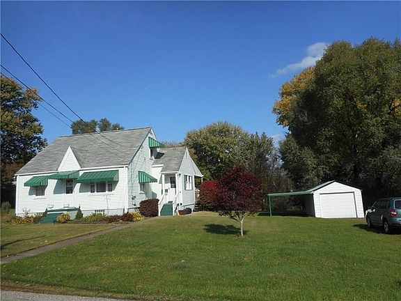 Exterior Front: The owner's pride is evident as you explore this meticulously maintained home ideally situated on over half a le