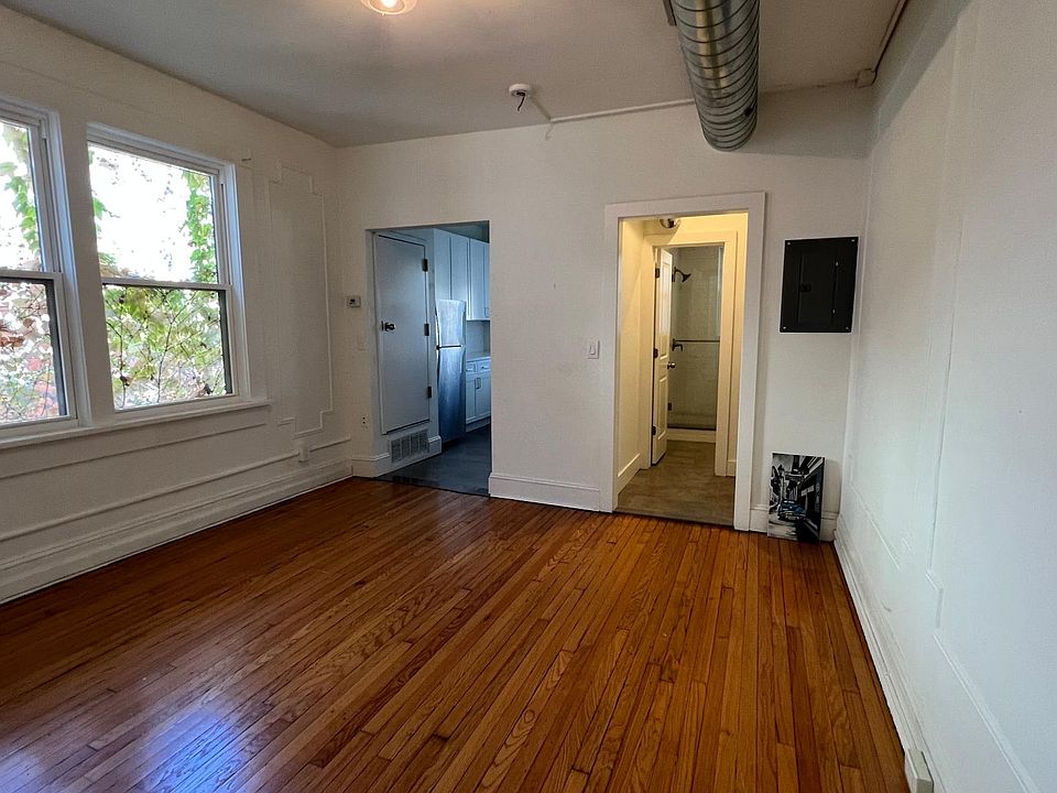 Living Room with Kitchen and bath in background