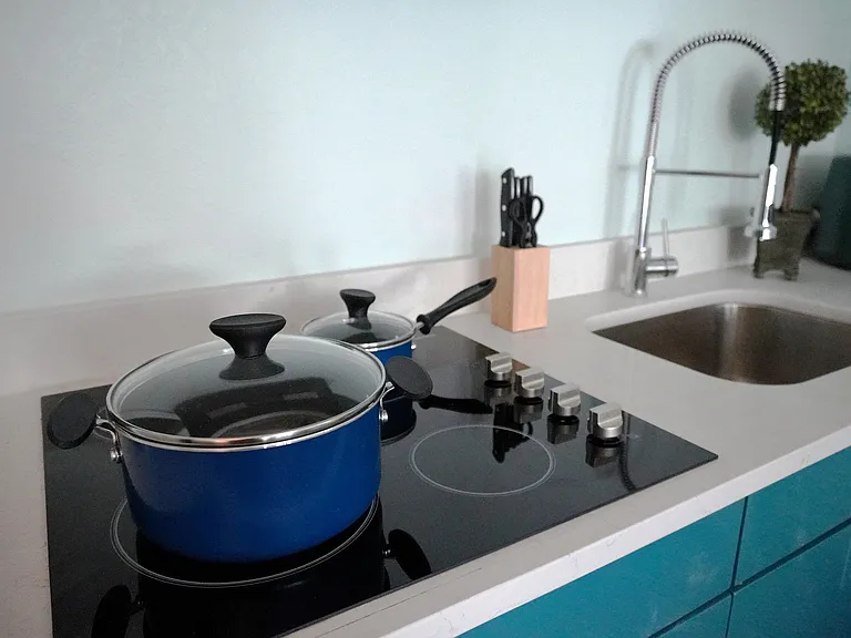 Experience culinary excellence with this stylish kitchen, featuring modern appliances and chic design.