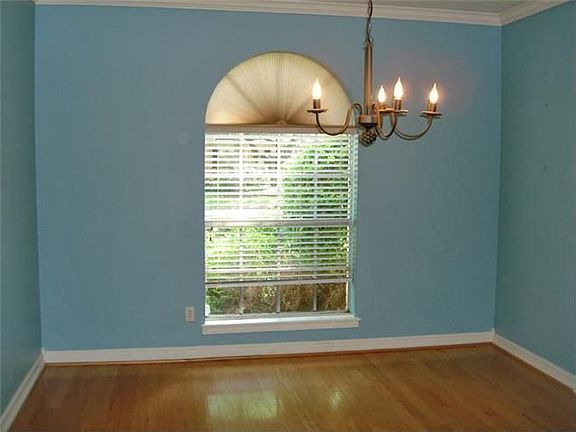 Wood flooring in formal dining room, this room has been neutralized.