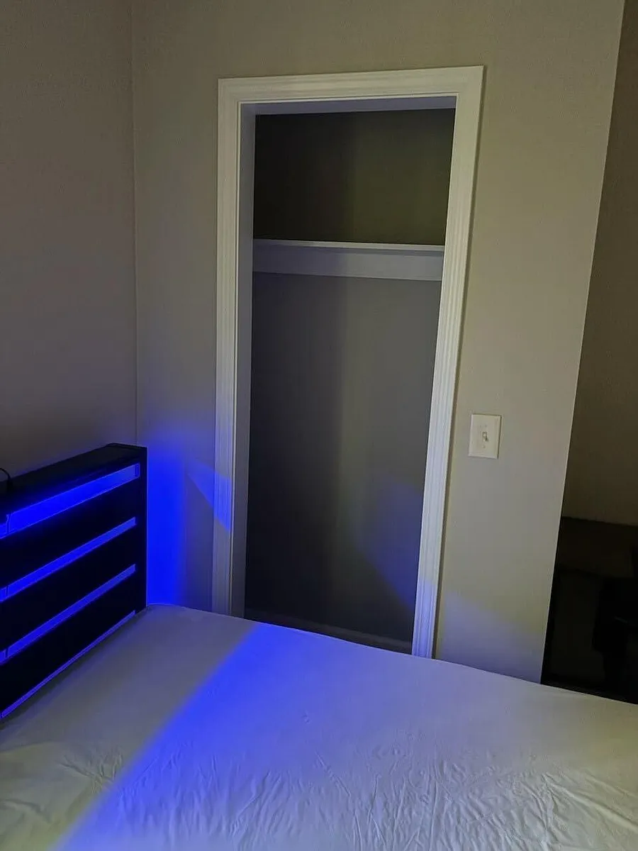 Private bedroom with space for a full/queen bed and an open closet for easy storage and organization. - Brown Bridge Rd