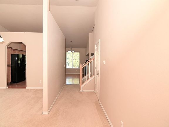 main floor hallway to kitchen area and stair to second floor.