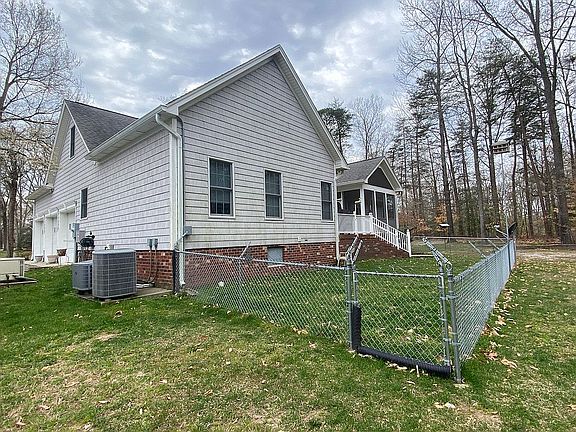 Rear of house w/fenced area