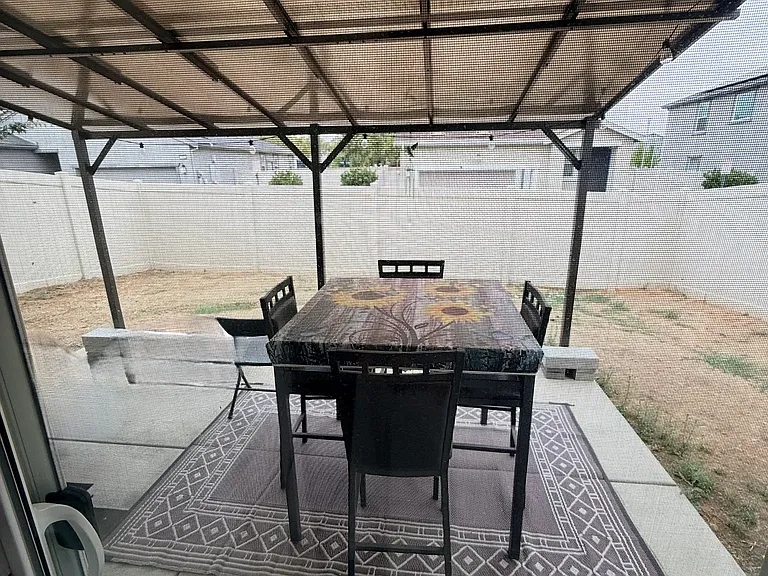 Spacious backyard with outdoor cover