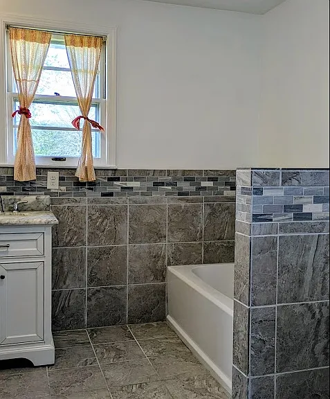 Updated full bathroom with separate tub and shower.