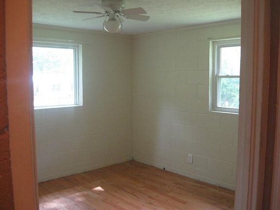 Bedroom #1 has 2 windows, hardwood floors, ceiling fan