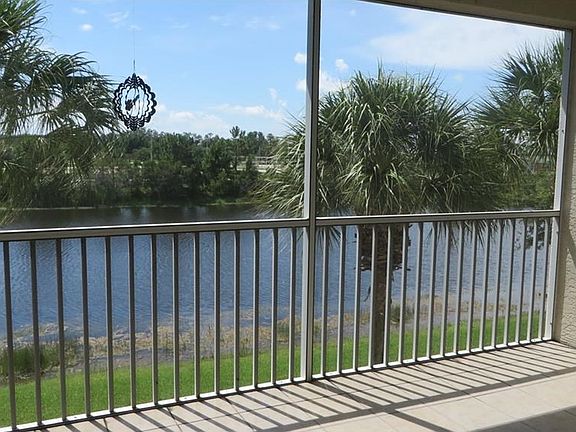 Peaceful lake view on tiled/screened lanai.