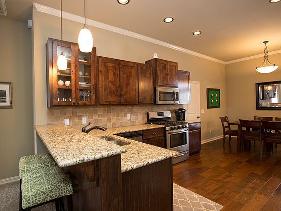 Granite counter tops and stainless appliances. 