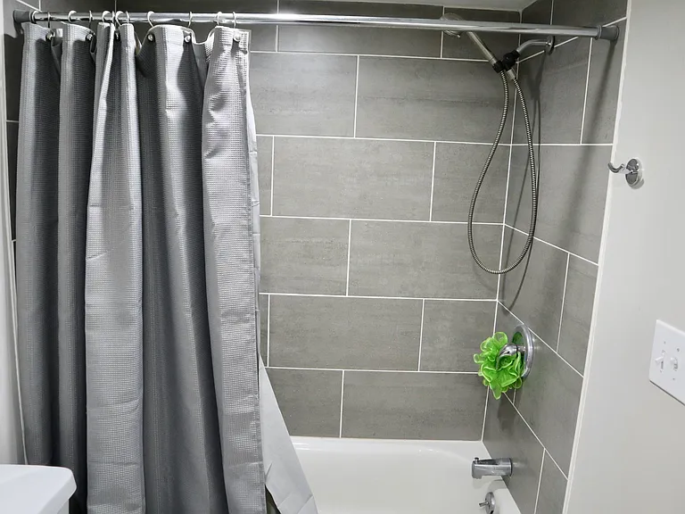 brand new bathroom with tiled backsplash
